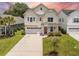 Charming two-story home with a well-manicured lawn and a two-car garage offering curb appeal and practicality at 106 Sago Ct, Summerville, SC 29486