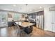 Modern kitchen features a large island with bar seating, granite countertops, and stainless steel appliances at 106 Sago Ct, Summerville, SC 29486