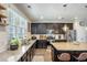 Modern kitchen featuring granite countertops, stainless steel appliances, and dark wood cabinetry at 106 Sago Ct, Summerville, SC 29486