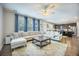 Spacious living room with a large sectional sofa, ottoman, and open concept to the kitchen at 106 Sago Ct, Summerville, SC 29486