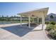 Outdoor pavilion with picnic tables, ceiling fans, and views of the pond at 106 Sago Ct, Summerville, SC 29486