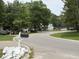 Scenic view of a quiet street with charming homes and lush greenery at 107 Tabby Creek Cir, Summerville, SC 29486