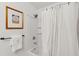 Cozy bathroom showcasing a shower-tub combo with tile surround and neutral shower curtain at 1107 S Shadow Dr, Mount Pleasant, SC 29464
