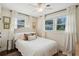 Bedroom features white bedding, many windows, and hardwood floors at 1107 S Shadow Dr, Mount Pleasant, SC 29464