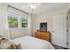 Bright bedroom with a ceiling fan, natural light, and a wooden dresser at 1107 S Shadow Dr, Mount Pleasant, SC 29464