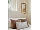 Close up of the bed with white linens and multiple decorative pillows at 1107 S Shadow Dr, Mount Pleasant, SC 29464