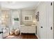 Charming Bedroom with hardwood floors, a dresser with changing top, and a cozy armchair at 1107 S Shadow Dr, Mount Pleasant, SC 29464