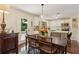 Open concept dining area shows access to a bright kitchen and deck, perfect for entertaining at 1107 S Shadow Dr, Mount Pleasant, SC 29464