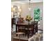 The dining room is accented with a rustic table, elegant seating, and natural light at 1107 S Shadow Dr, Mount Pleasant, SC 29464