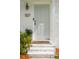 Close-up of the front door showing the house number, doorbell, and brick steps at 1107 S Shadow Dr, Mount Pleasant, SC 29464