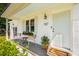 Welcoming front porch with chairs, a flower box, and a charming door at 1107 S Shadow Dr, Mount Pleasant, SC 29464