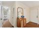 Entry hall with wood floors, natural wood cabinet, mirror, and neutral paint at 1107 S Shadow Dr, Mount Pleasant, SC 29464