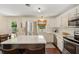 Updated kitchen with white cabinets, stainless appliances, and a center island with seating at 1107 S Shadow Dr, Mount Pleasant, SC 29464