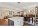 Open-concept living space with a kitchen island, living room seating, and a dining area at 1107 S Shadow Dr, Mount Pleasant, SC 29464