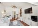Airy living area features a mini-split system, TV and comfortable seating, offering a cozy retreat at 1107 S Shadow Dr, Mount Pleasant, SC 29464