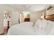 Comfortable bedroom with a king bed, ceiling fan, closet, leading to en-suite bathroom. Hardwood floors throughout at 1107 S Shadow Dr, Mount Pleasant, SC 29464