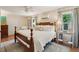 Inviting main bedroom with a king bed, ceiling fan, windows with lots of natural light and hardwood floors at 1107 S Shadow Dr, Mount Pleasant, SC 29464