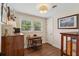 Cozy office space with hardwood floors, wood desk and chair, and natural light at 1107 S Shadow Dr, Mount Pleasant, SC 29464