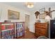 Cozy office space with hardwood floors, wood desk and chair, and natural light at 1107 S Shadow Dr, Mount Pleasant, SC 29464
