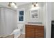 Bright bathroom with a wood vanity, toilet, and a shower/tub at 112 Fox Chase Dr, Goose Creek, SC 29445