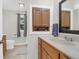Neat bathroom featuring wood vanity, tile floors, and built in cabinet at 112 Fox Chase Dr, Goose Creek, SC 29445