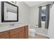 Well-lit bathroom with a wood vanity, tile floors, and a shower/tub combo at 112 Fox Chase Dr, Goose Creek, SC 29445