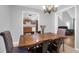 Cozy dining room with tile flooring, wooden table set, and a view into the kitchen at 112 Fox Chase Dr, Goose Creek, SC 29445