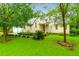 Charming two-story home featuring a well-manicured lawn and mature trees at 112 Fox Chase Dr, Goose Creek, SC 29445