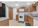 Functional kitchen with wood cabinets, white appliances, and tile flooring at 112 Fox Chase Dr, Goose Creek, SC 29445