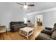 Inviting living room with hardwood floors, ceiling fan, and comfortable seating at 112 Fox Chase Dr, Goose Creek, SC 29445