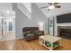 Vaulted living room with hardwood floors, fireplace, and access to other rooms at 112 Fox Chase Dr, Goose Creek, SC 29445