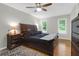 Comfortable main bedroom with wood floors, ceiling fan, and natural light at 112 Fox Chase Dr, Goose Creek, SC 29445