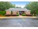 Brick pool house features manicured landscaping and designated parking at 112 Fox Chase Dr, Goose Creek, SC 29445