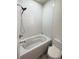 Close up view of a bathroom showing a white bathtub with shower, a white toilet, and neutral paint at 1225 Blakeway St # 906, Charleston, SC 29492