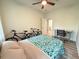 This is a bedroom boasting a desk, two bicycles, and a bed with a blue and green comforter at 1225 Blakeway St # 906, Charleston, SC 29492