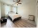 Bright bedroom with ceiling fan, natural light, and modern flooring at 1225 Blakeway St # 906, Charleston, SC 29492