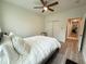 This is a comfortable bedroom with neutral walls, a ceiling fan, and a sliding-door closet at 1225 Blakeway St # 906, Charleston, SC 29492