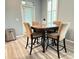 Dining area featuring a table with seating for four, natural light, and a modern aesthetic at 1225 Blakeway St # 906, Charleston, SC 29492