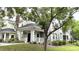 Charming condo exterior showcases green siding, covered porch, and black front door at 1225 Blakeway St # 906, Charleston, SC 29492