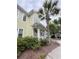 Charming home exterior with a lush green yard, palm tree, and a welcoming front porch at 1225 Blakeway St # 906, Charleston, SC 29492