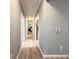 Spacious hallway with updated flooring, neutral paint, and easy access to rooms at 1225 Blakeway St # 906, Charleston, SC 29492