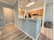 Kitchen features a breakfast bar, modern lighting, and stainless appliances at 1225 Blakeway St # 906, Charleston, SC 29492
