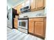 Kitchen featuring stainless steel appliances, wood cabinets, and modern accents at 1225 Blakeway St # 906, Charleston, SC 29492