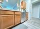 Close up on the kitchen area with stainless dishwasher and modern cabinets at 1225 Blakeway St # 906, Charleston, SC 29492