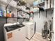 Well-organized laundry room with washer, dryer, wire shelving, and ample storage space at 1225 Blakeway St # 906, Charleston, SC 29492