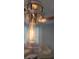 A modern clear glass and metal light fixture with an Edison bulb adds rustic charm at 1225 Blakeway St # 906, Charleston, SC 29492