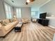 Comfortable living room with neutral tones, plantation shutters, and updated flooring at 1225 Blakeway St # 906, Charleston, SC 29492