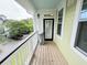 Charming outdoor patio with wood flooring, white railings, and views of the neighborhood at 1225 Blakeway St # 906, Charleston, SC 29492