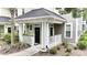 Inviting covered porch with black door and white railings enhance curb appeal at 1225 Blakeway St # 906, Charleston, SC 29492