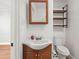 Bathroom with classic fixtures and vanity, complete with a wooden cabinet at 1248 Sumner Ave, North Charleston, SC 29406